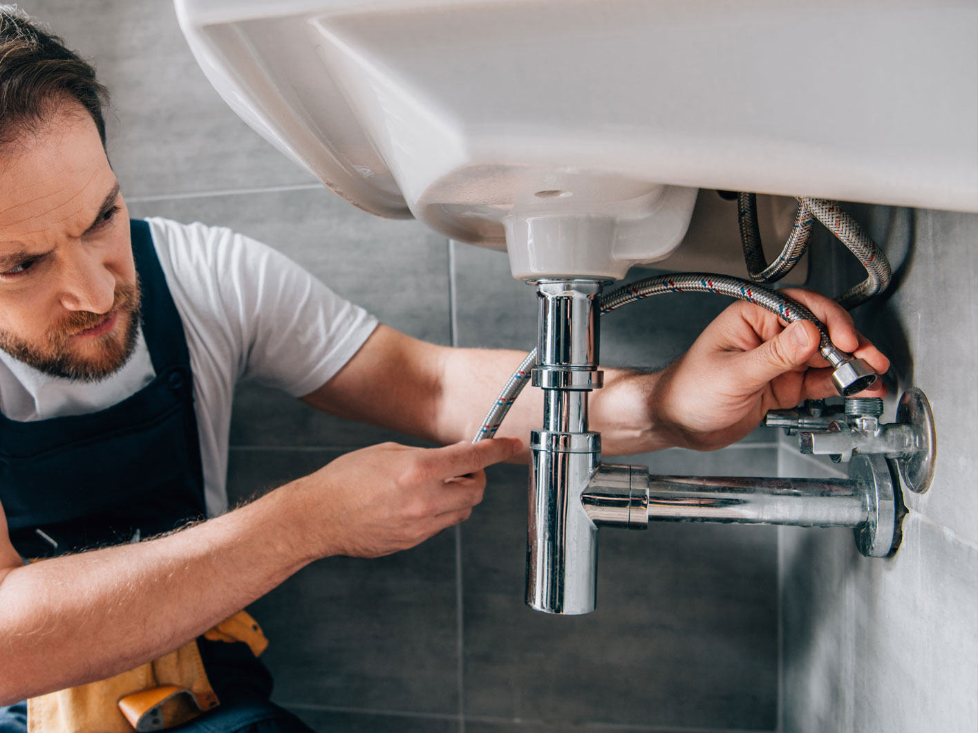 Plumber Attaching Water Pipes 2 Plumber Attaching Water Pipes 2